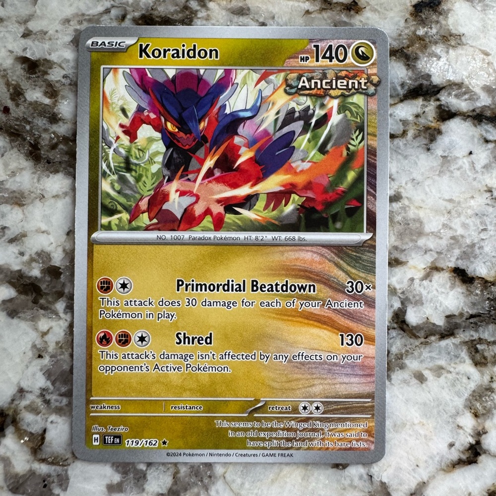 Pokemon Koraidon Card with Red and Gold Accents